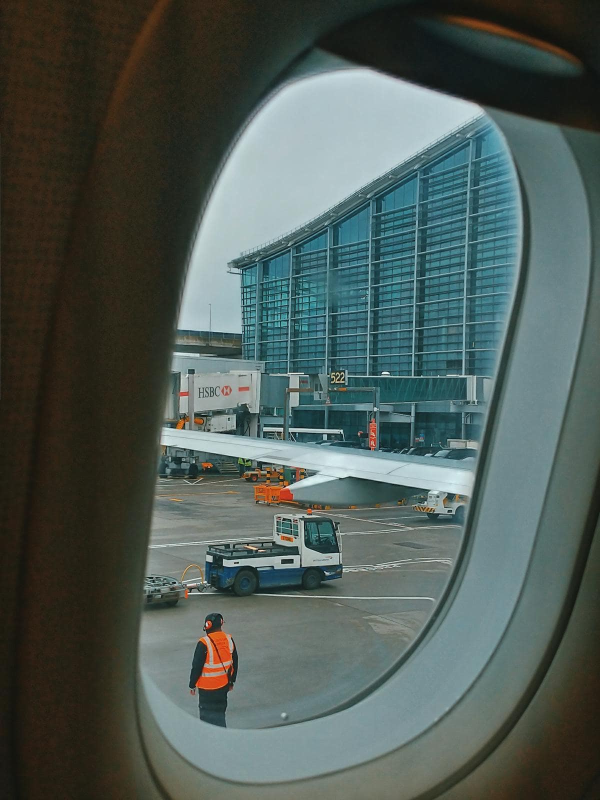 Airport tarmac viewed through a plane window