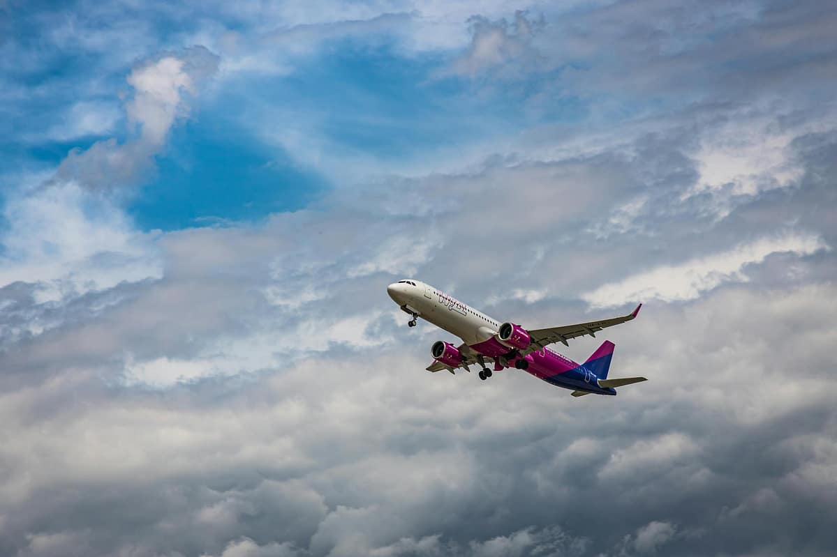 airplane under a cloudy sky