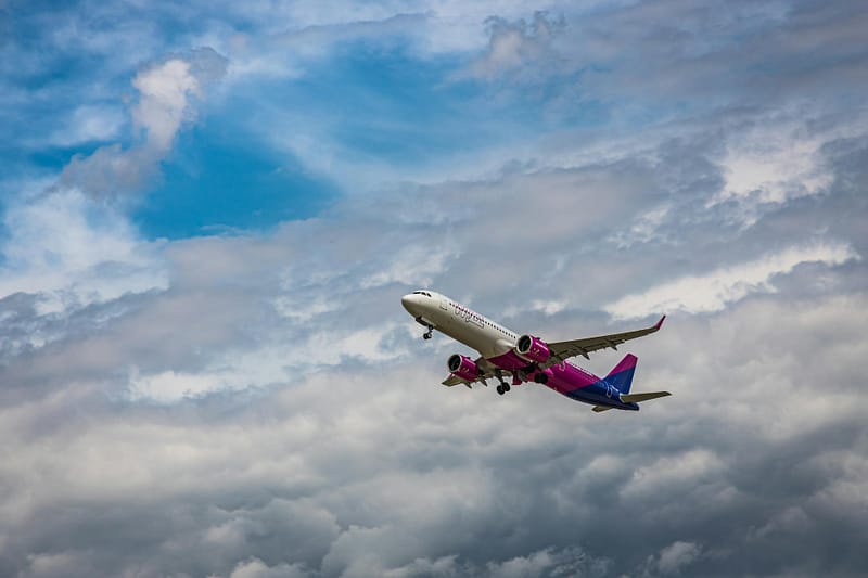 airplane under a cloudy sky