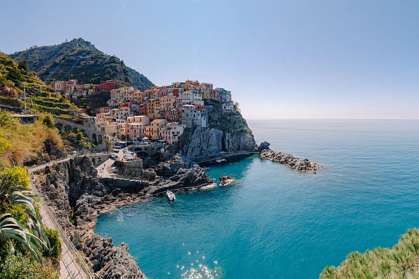 Colourful houses of Manarola village rising from the rocky Cinque Terre coastline