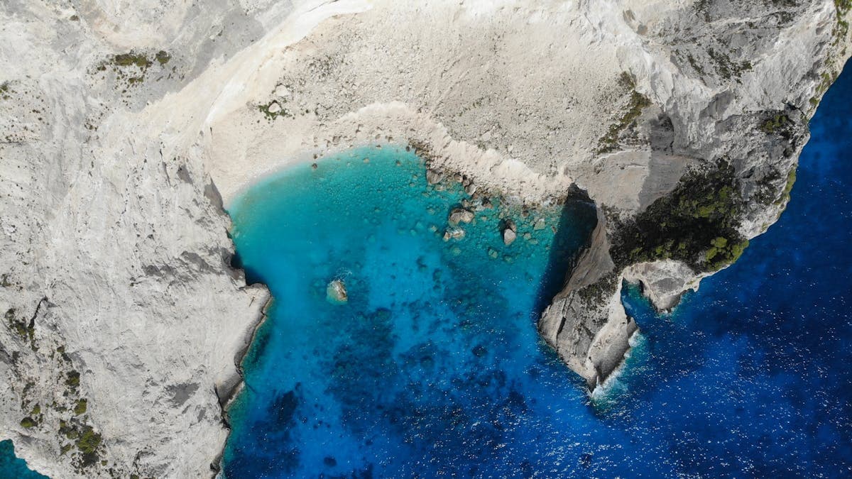 Aerial view of the turquoise sea and dramatic coastline of Zakynthos island, Greece