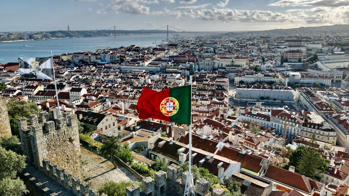 Panoramic view of Lisbon's terracotta rooftops and the River Tagus from the walls of Castelo de Sao Jorge