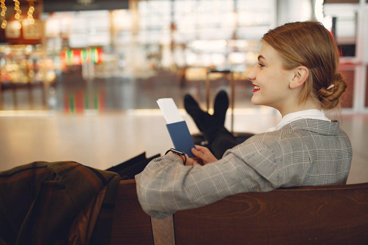 Traveller relaxing at an airport departure gate