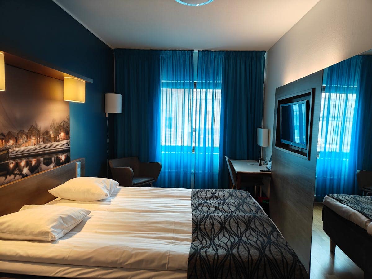 A clean, modern budget hotel room suitable for a family stay during UK school holidays