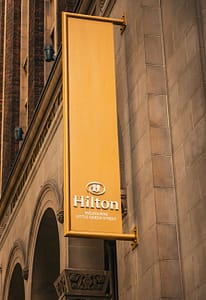hilton hotel sign on historic building in melbourne
