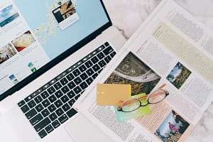 Travel planning with laptop and credit cards for British Airways booking