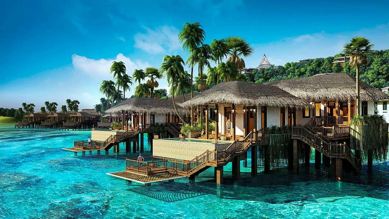 huts near body of water