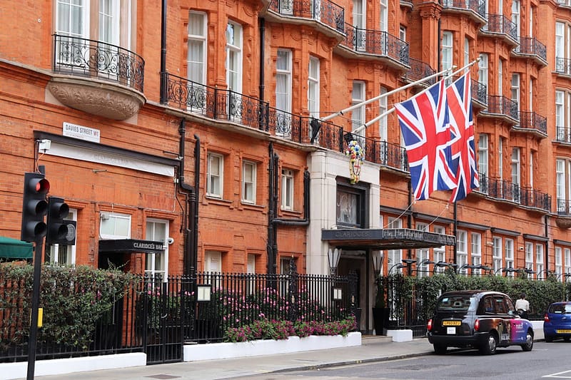 A classic British hotel with Union Jack flags outside, representing UK school holiday hotel options