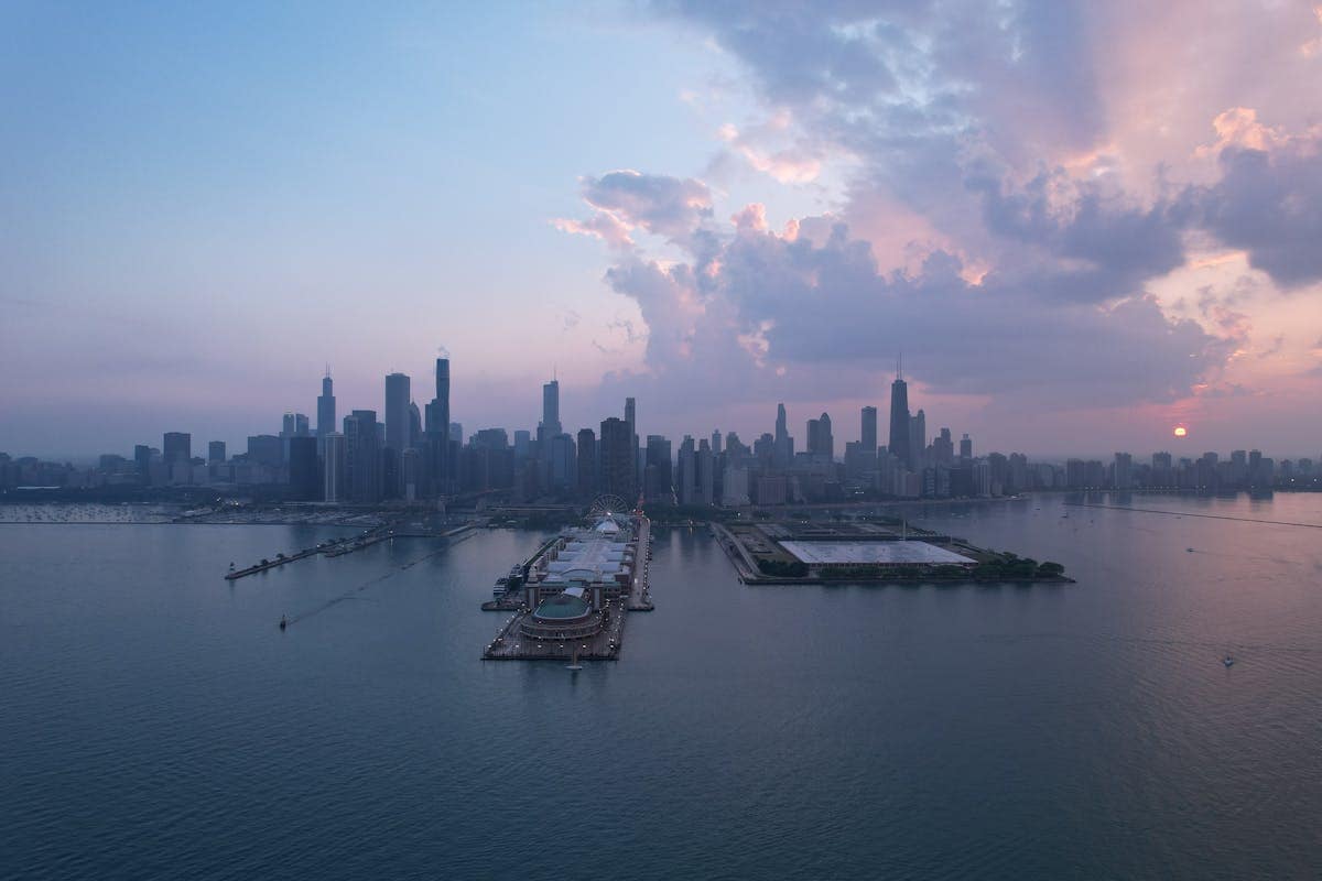 Chicago downtown skyline at dusk with the Chicago River in the foreground