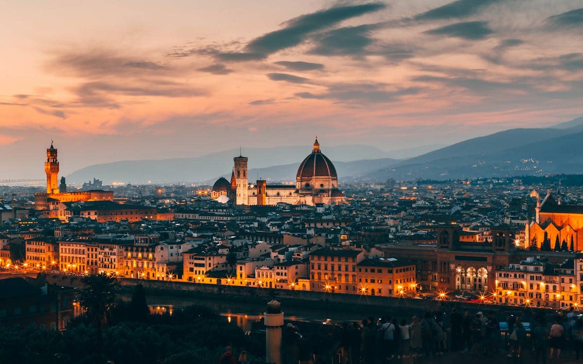 Florence skyline at night showing the Duomo and Palazzo Vecchio from Piazzale Michelangelo