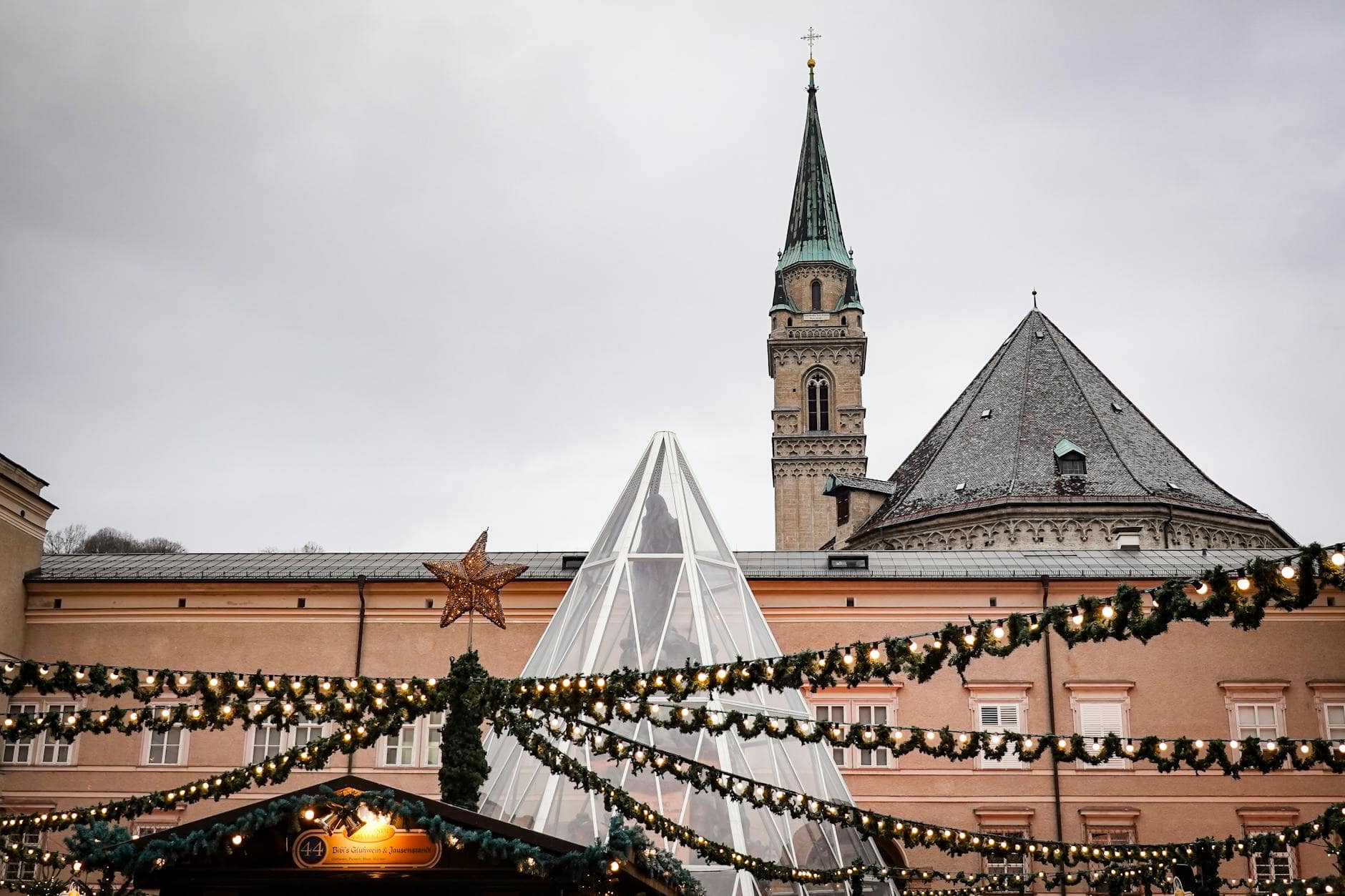 Charming Christmas market with illuminated stalls and historic buildings, Christmas break ideas