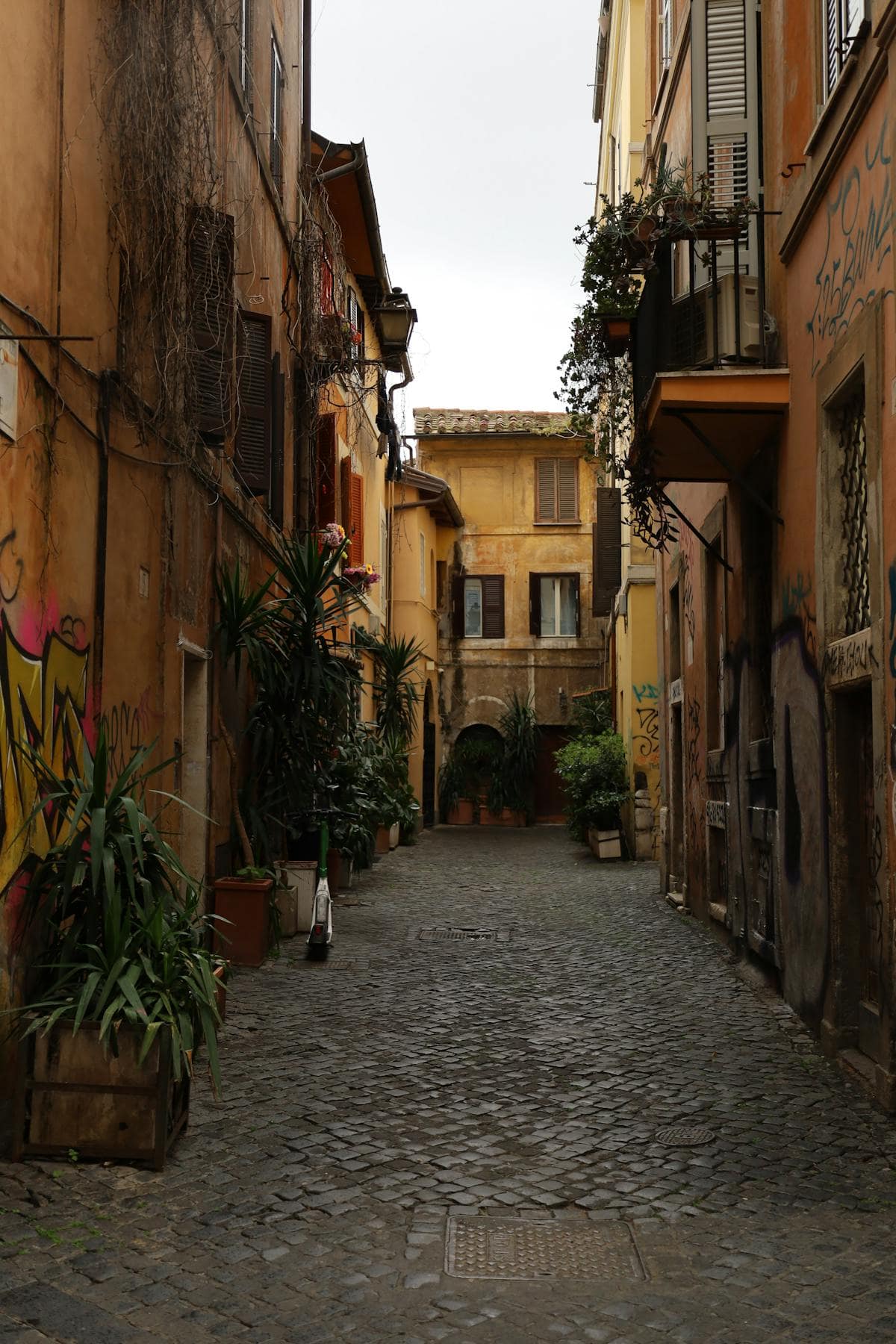 Charming cobblestone street in Rome, Italy, lined with terracotta buildings