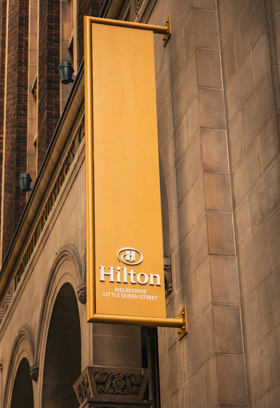 hilton hotel sign on historic building in melbourne