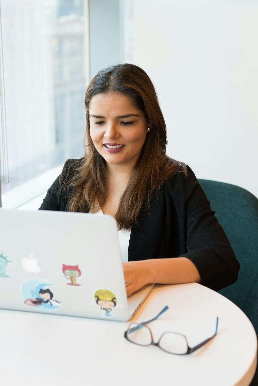 Person planning travel, checking flight prices on laptop